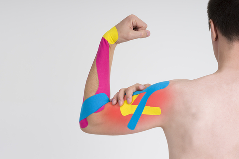 Sports Massage Therapy with Kinesiology Taping.